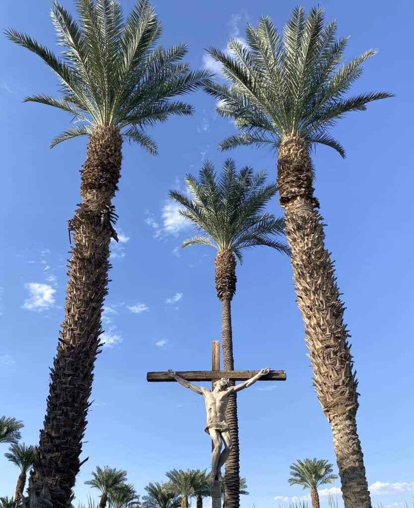 The Walk at Shields Date Garden depicts the life of Jesus - His cross is positioned among 3 palm trees (Luke 23:32)